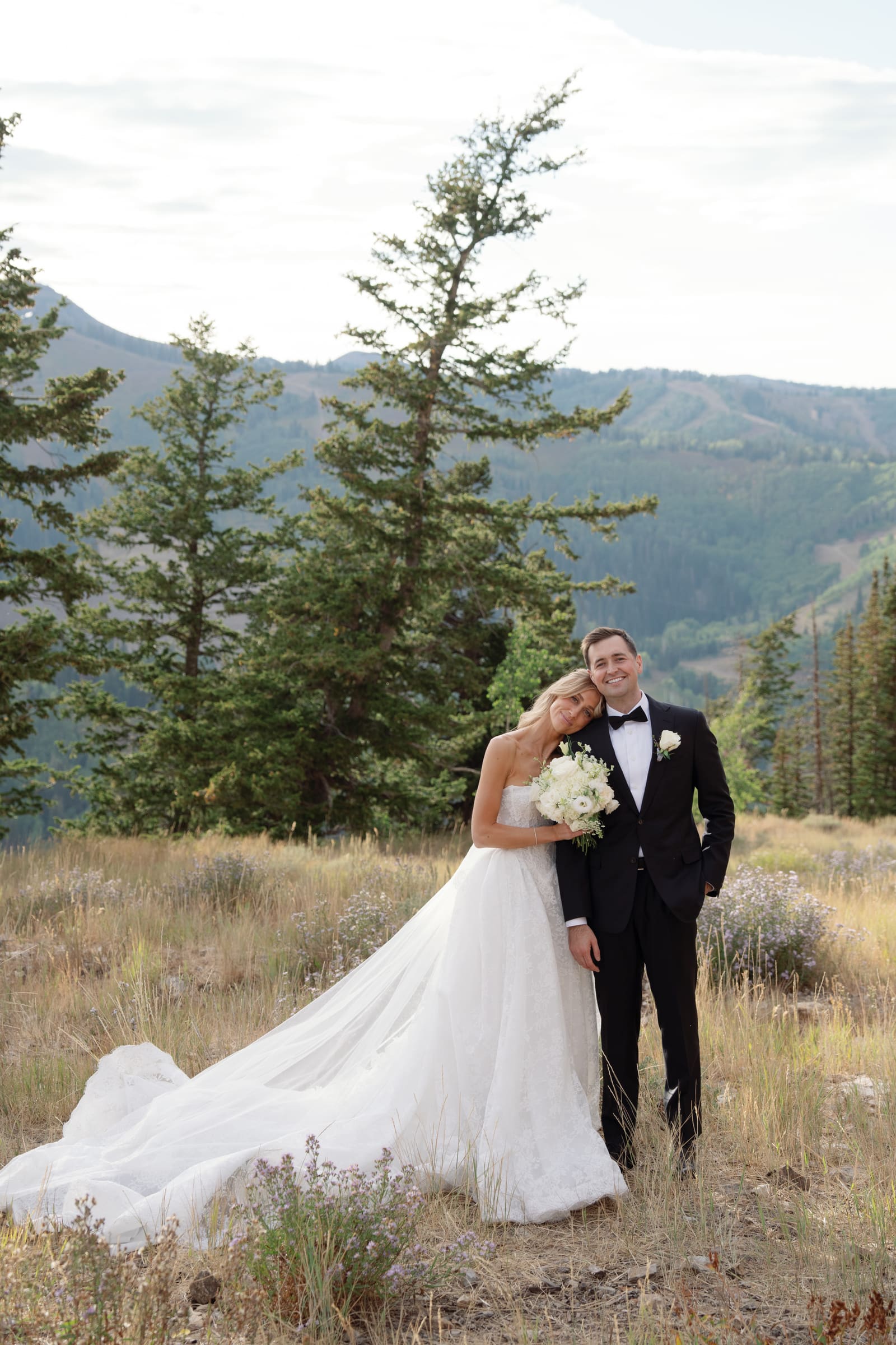 A couple photographed in the Utah mountains at golden hour